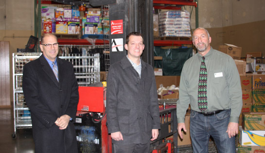 Associated donates forklift to Loaves and Fishes non-profit organization